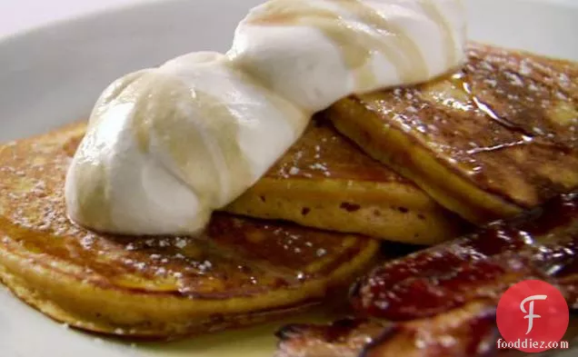 Orange Pumpkin Pancakes with Vanilla Whipped Cream, Cinnamon Maple Syrup and Thick-Cut Bacon