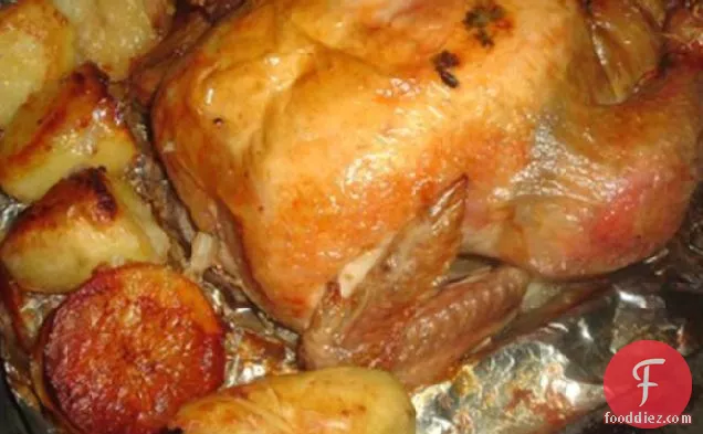 Onion Stuffed Roast Chicken With Potatoes