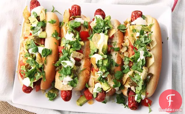 Bacon-Wrapped Hot Dogs with Avocado, Tomato, Onion, Mayonnaise, and Potato Chips