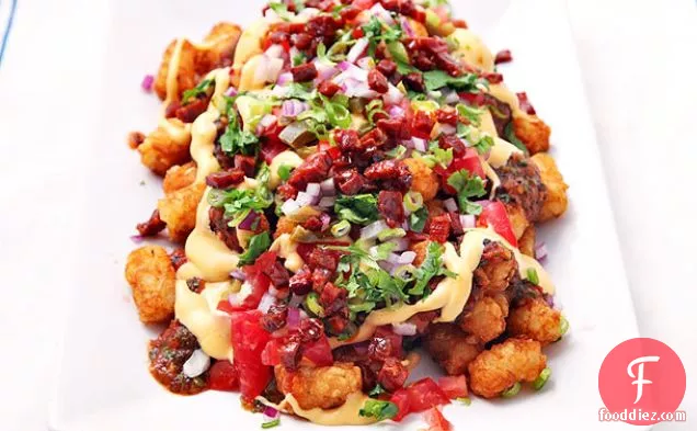 Totchos (Tater Tot Nachos) with Cheese Sauce, Charred Tomato Salsa, Chorizo, and Pickled Jalapeños