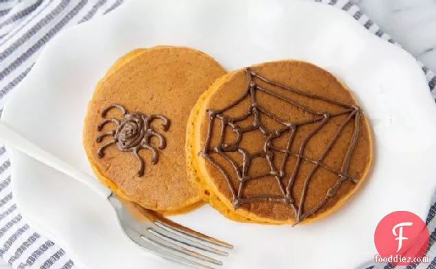 Pumpkin Pancakes with Chocolate Spiderwebs