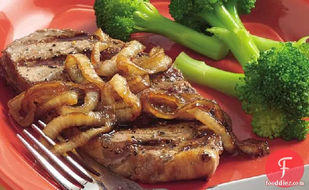 Pepper-Rubbed Grilled Steaks with Caramelized Onions