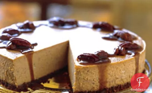 Spiced Pumpkin Cheesecake with Caramel-Bourbon Sauce