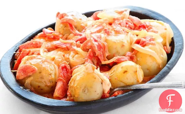 Papas Chorreadas (Colombian Potatoes with Cheese and Tomato Sauce)