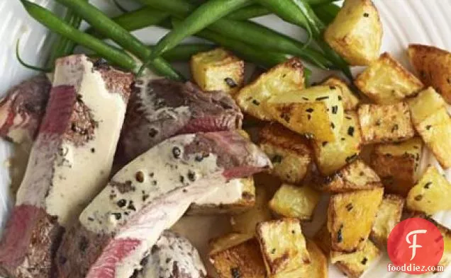 Beef with peppercorn sauce & sauté potatoes