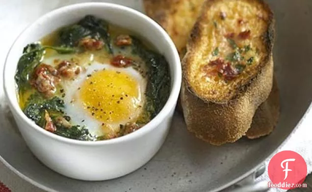 Spinach baked eggs with parmesan & tomato toasts