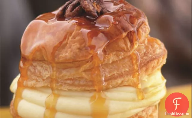 Soufflé of Puff Pastry with Orange-Scented Pastry Cream, Candied Pecans, and Caramel Butter Sauce