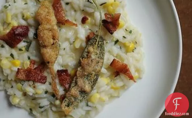 Corn Risotto Garnished with Bacon & Anchovy Sage Leaf Bite