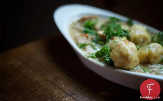 a : chicken and gluten-free dumplings with fresh herbs