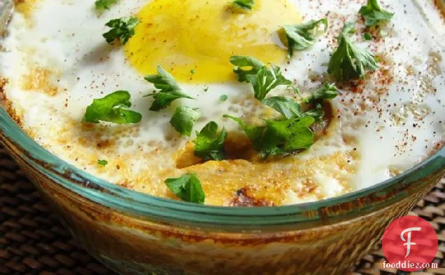 Baked Eggs Over Roasted Tomatoes And Citrus Herb Couscous