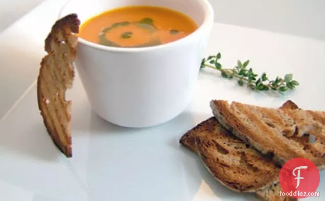Roasted Orange Pepper Tomato Soup With Basil Oil And Bread Chips