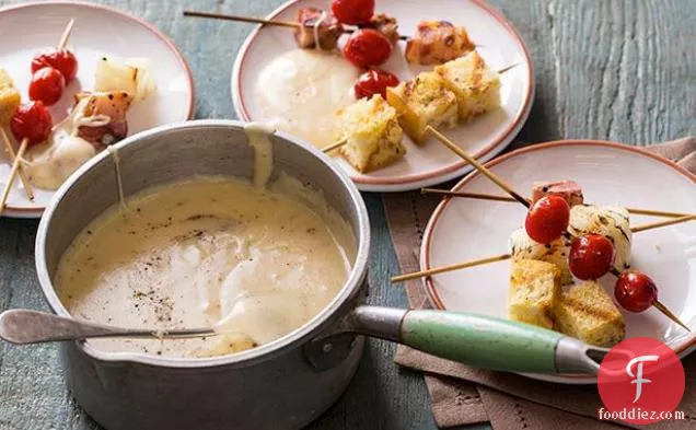 Aged Cheddar Fondue with Grilled Tomatoes, Bacon and Onions