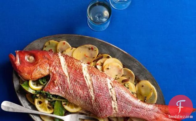 Whole Roasted Fish With Sliced Potatoes, Olives and Herbs