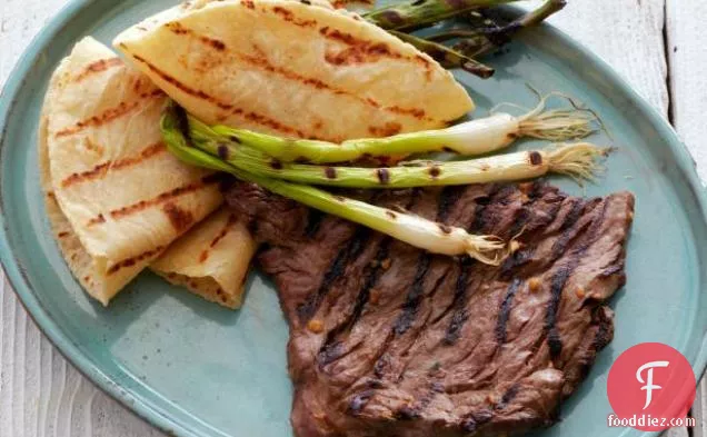 Korean-Style Marinated Skirt Steak with Grilled Scallions and Warm Tortillas