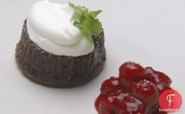 Warm Chocolate Gateaux Topped with Sour Cream Quenelle and Raspberry Sauce