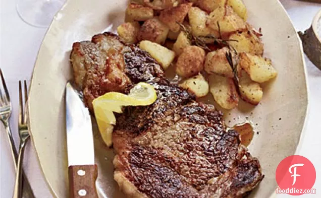 Grilled Rib-Eye Steaks with Roasted Rosemary Potatoes