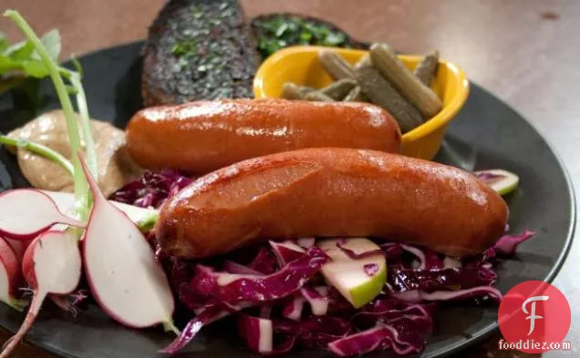 Braised Wurst Sausages with Cabbage, Red Onion and Apple Slaw