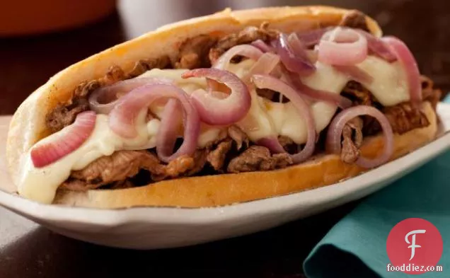 Philly Cheesesteaks with Melted Fontina and Sauteed Red Onions