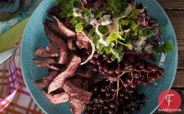Broiled Flank Steak with Grilled Champagne Grapes and a Bitter Greens and Blue Cheese Salad