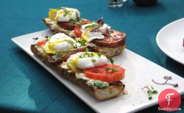 Poached Eggs on Toasted Baguette with Goat Cheese, and Black Pepper Vinaigrette