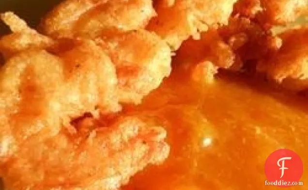 टैंगी पीच सॉस के साथ काजुन झींगा