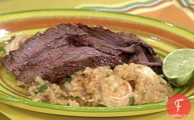 Sliced Chili Rubbed Flank Steak on Spicy Rice with Shrimp and Guacamole Stacks
