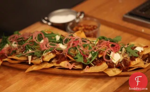 Sweet and Spicy Sausage Ragu Nachos with Pickled Onions
