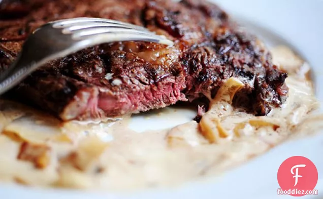 Grilled Ribeye Steak With Onion Blue Cheese Sauce