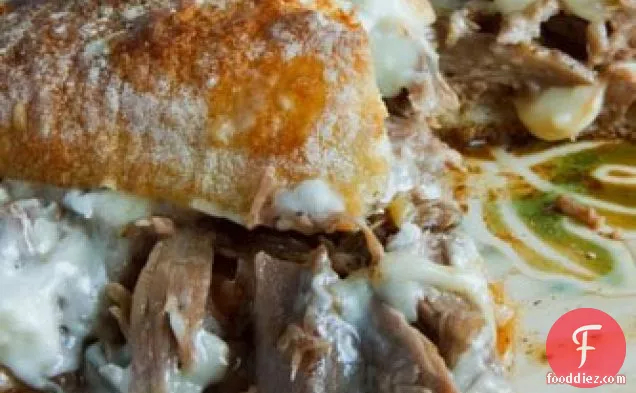 Pot Roast Sandwich Smothered In Gravy With Melted Swiss Cheese