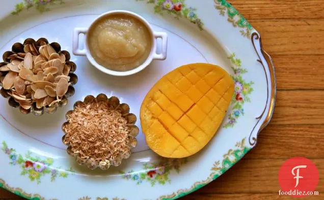 Breakfast Quinoa With Toasted Coconut, Almonds And Fresh Mango
