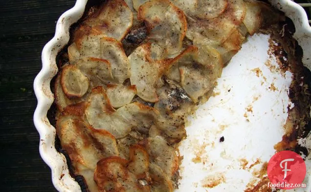 Potato, Caramelised Onion And Anchovy Bake