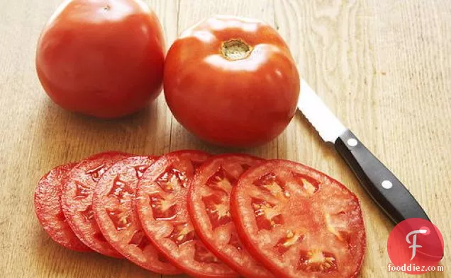 टमाटर और हरीसा के साथ बेक्ड मछली