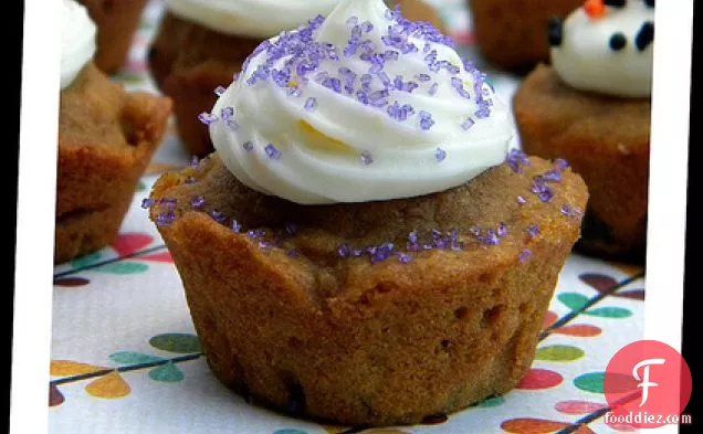 Pumpkin Gingerbread Muffins With Orange Cream Cheese Frosting