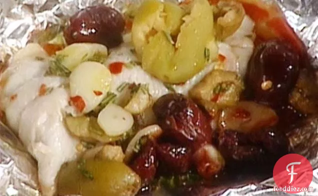 काले और हरे जैतून के साथ रोस्ट ट्राउट: ट्रोटा एरोस्टो कॉन ऑलिव नेरे ई वर्डी