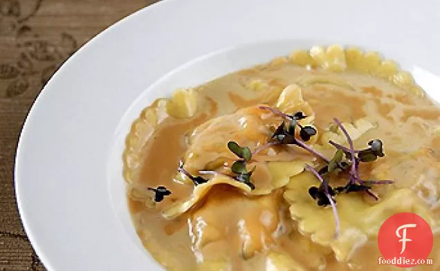 Lobster ravioli with lobster broth and a lemongrass-shellfish sauce
