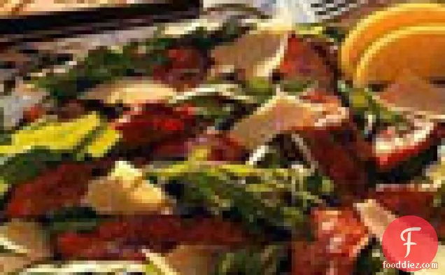 अरुगुला और मुंडा परमेसन के साथ ग्रील्ड स्टेक