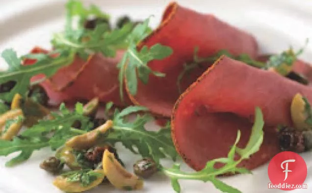 Sliced Beef And Arugula Salad With Green Olive And Raisin Salsa