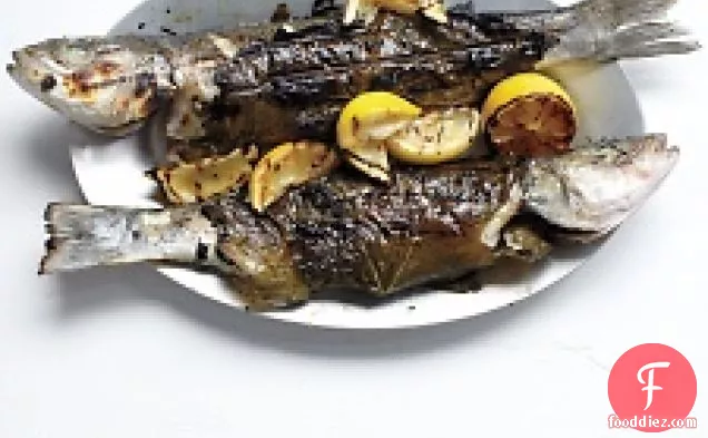 Whole Branzino In Grape Leaves With Zucchini, Olives, And Mint